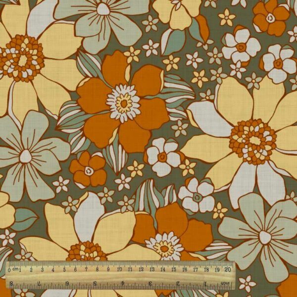 large brightly coloured orange mod floral fabric with ruler
