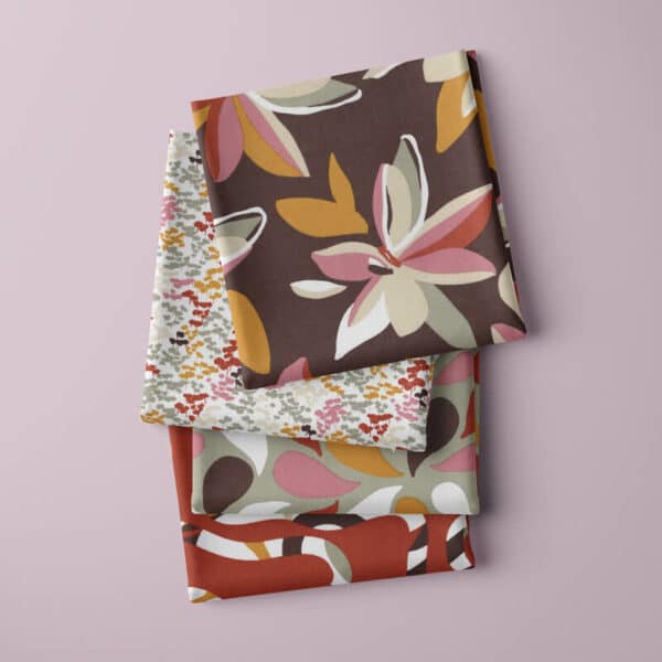 squares of folded fabric in all designs in the maxine cotton modern fabric collection