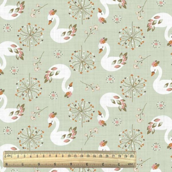 swans on geeen cotton fabric from the adele range of fabrics with ruler