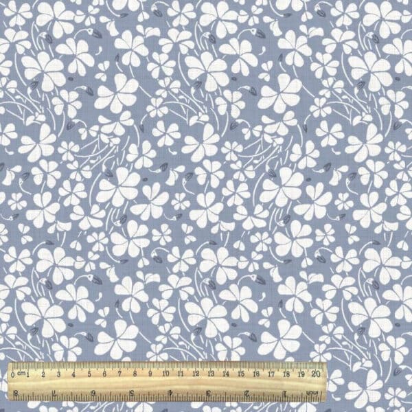 oxalis floral print in blue from the Odisha fabric collection with ruler