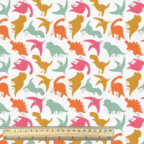 colourful dinosaurs on white cotton fabric with ruler
