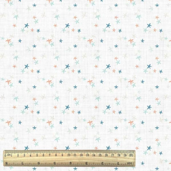 starfish cotton fabric nursery print in blue and white with ruler