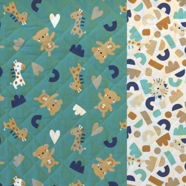 Quilted double sided cotton fabric in an alphabet children's nursery design - teal