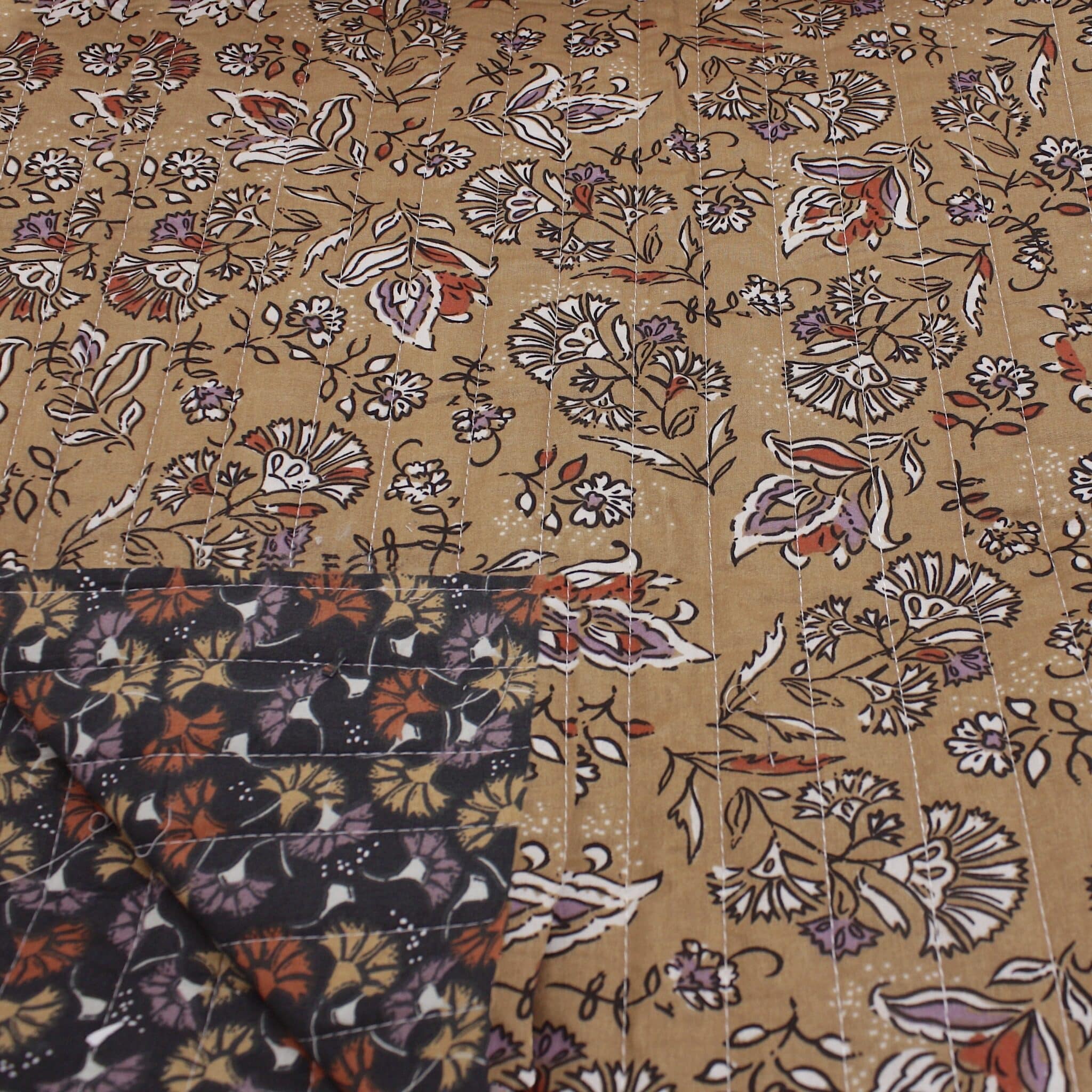 Quilted double sided cotton fabric in elegant rich tones of brown floral design